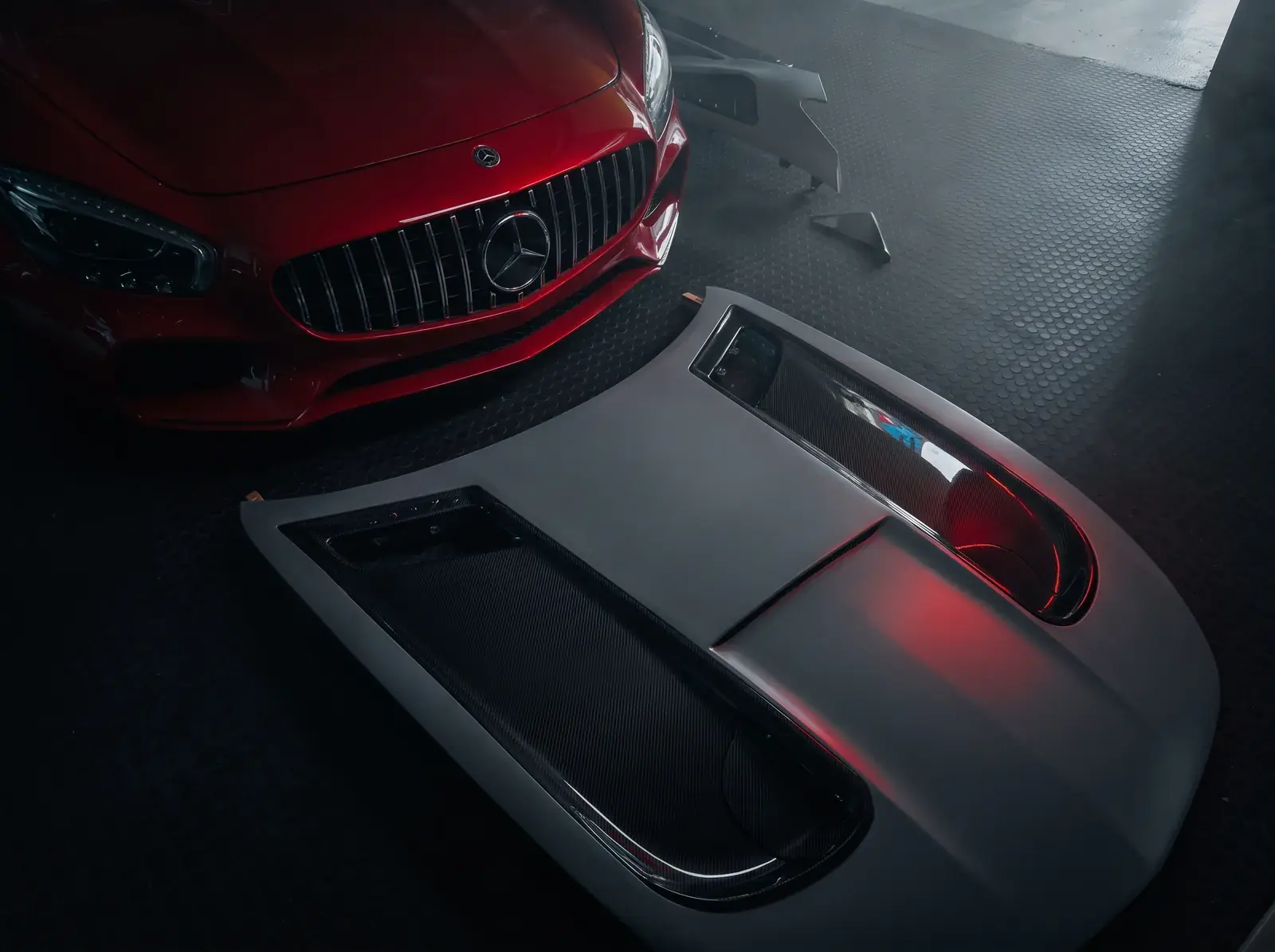 Exposed weave, water-clear lacquer. — AMG GT conversion at Smoke Customs